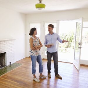 Woman speaking with realtor in a home
