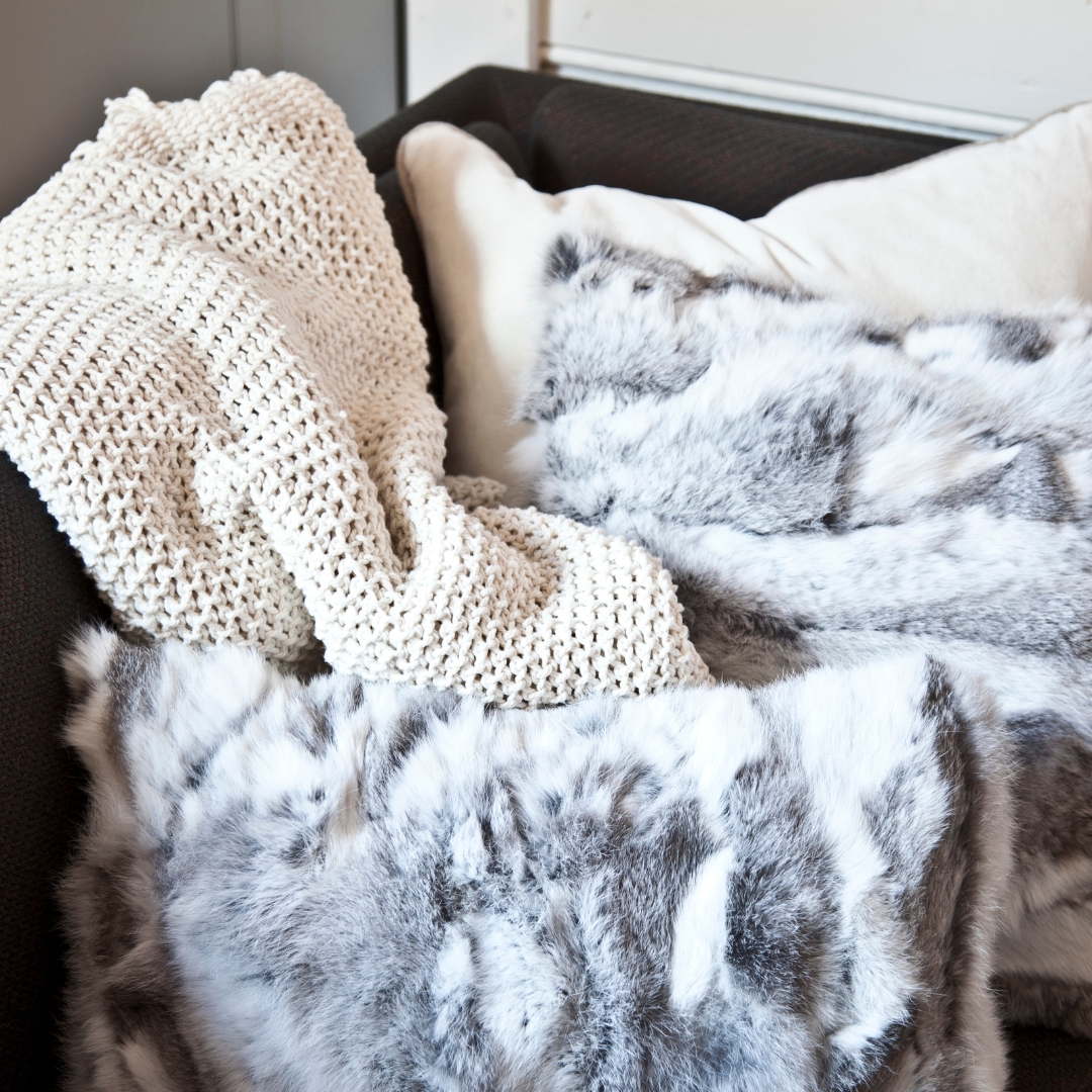 cozy blankets and bedding on a chair